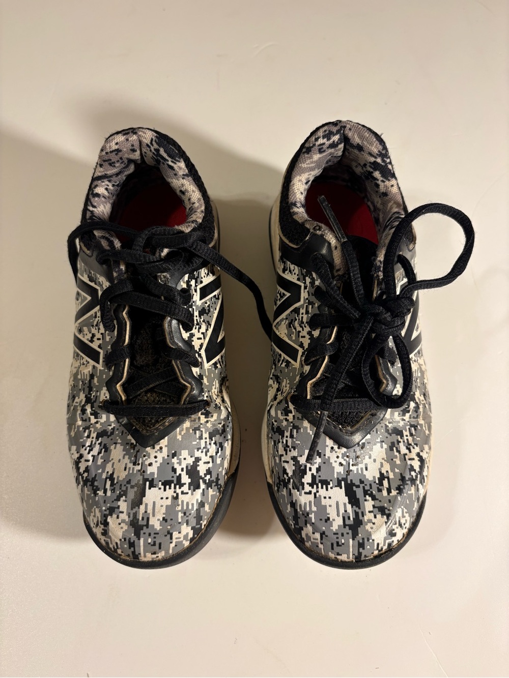 New Balance Kids Digital Camo ball cleats in Black and Gray